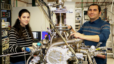 A woman and a man stand in the laboratory