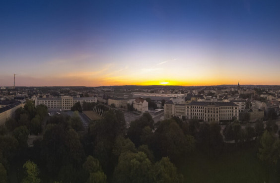 view of the campus from above with sunset